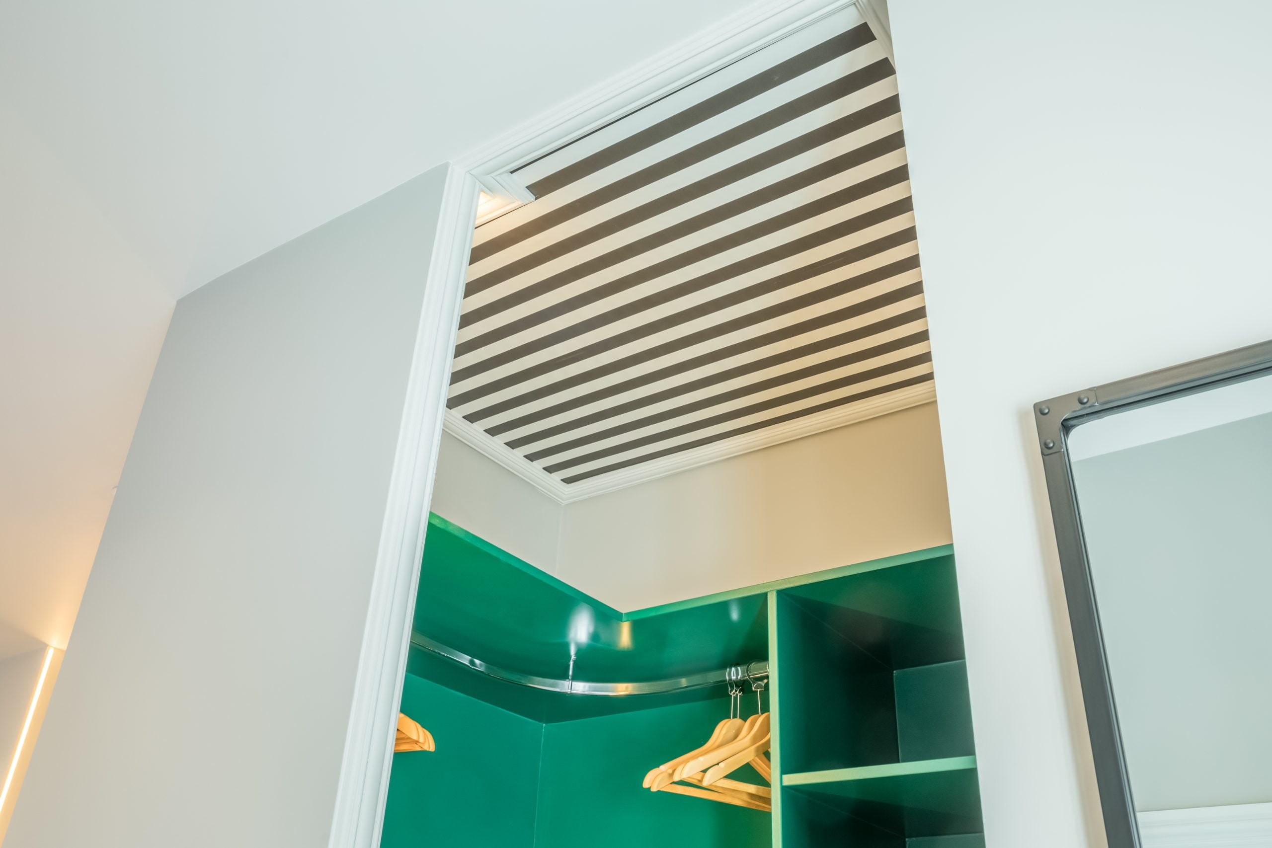 wallpapered ceiling in walk in wardrobe