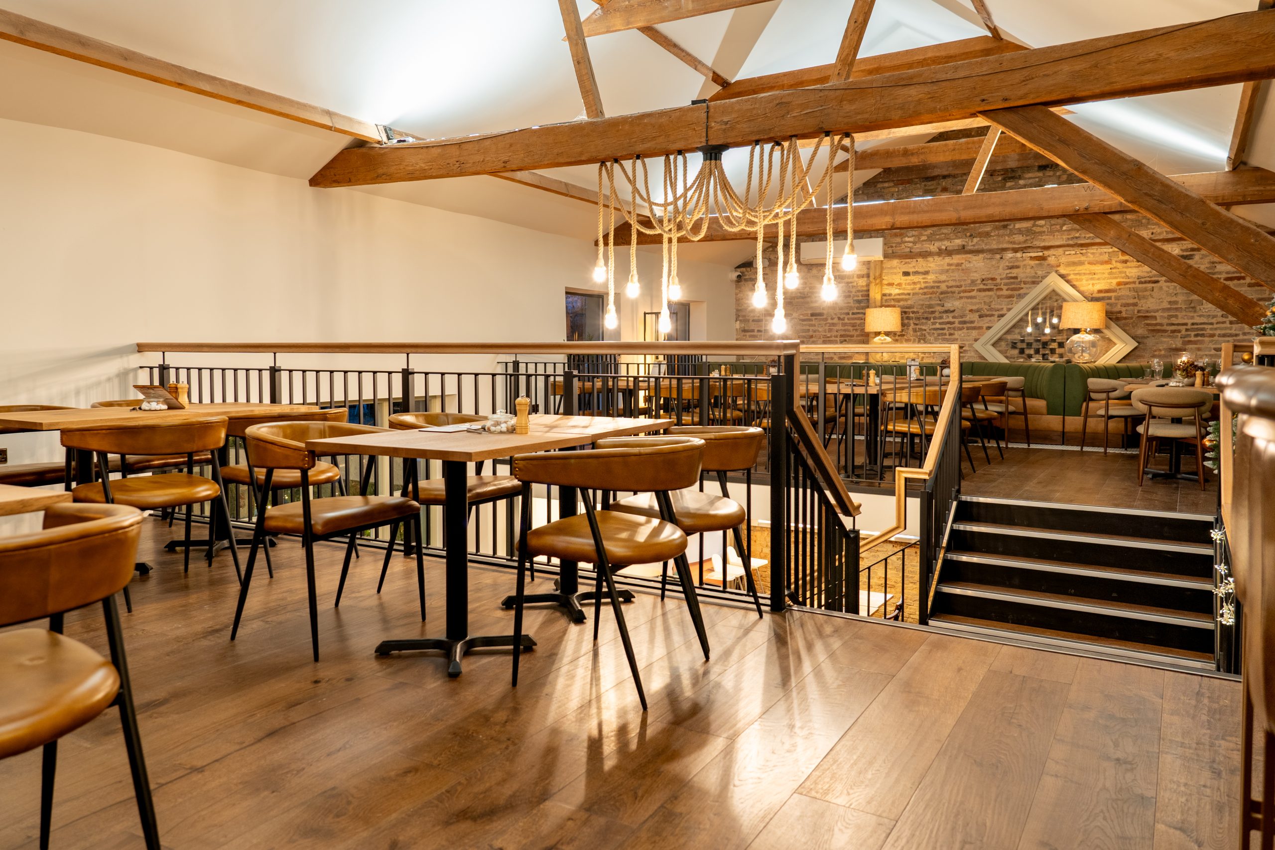 LOT 25, WILLINGHAM | COMMERCIAL CLIENT Restaurant Interior Design By Styled Home Design Vaulted ceiling in barn and leather chairs