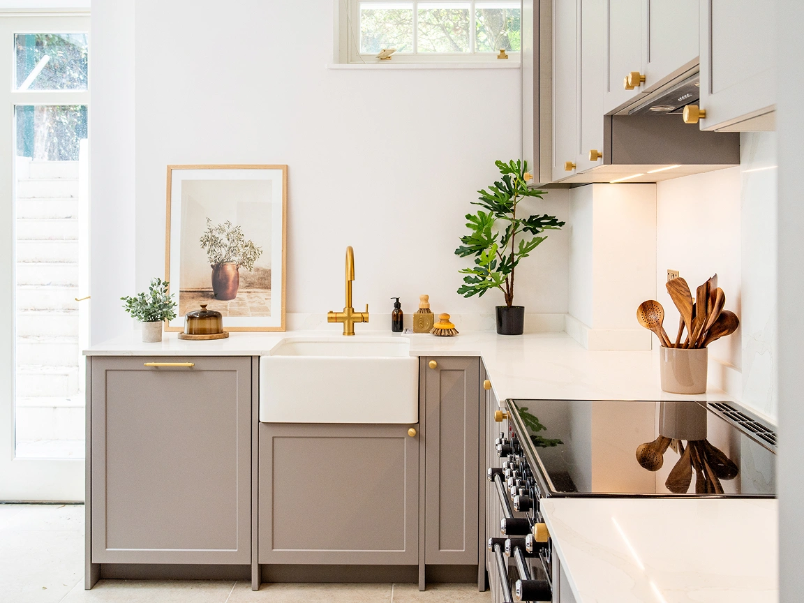 modern-kitchen-with-brass-accents-and-butler-sink
