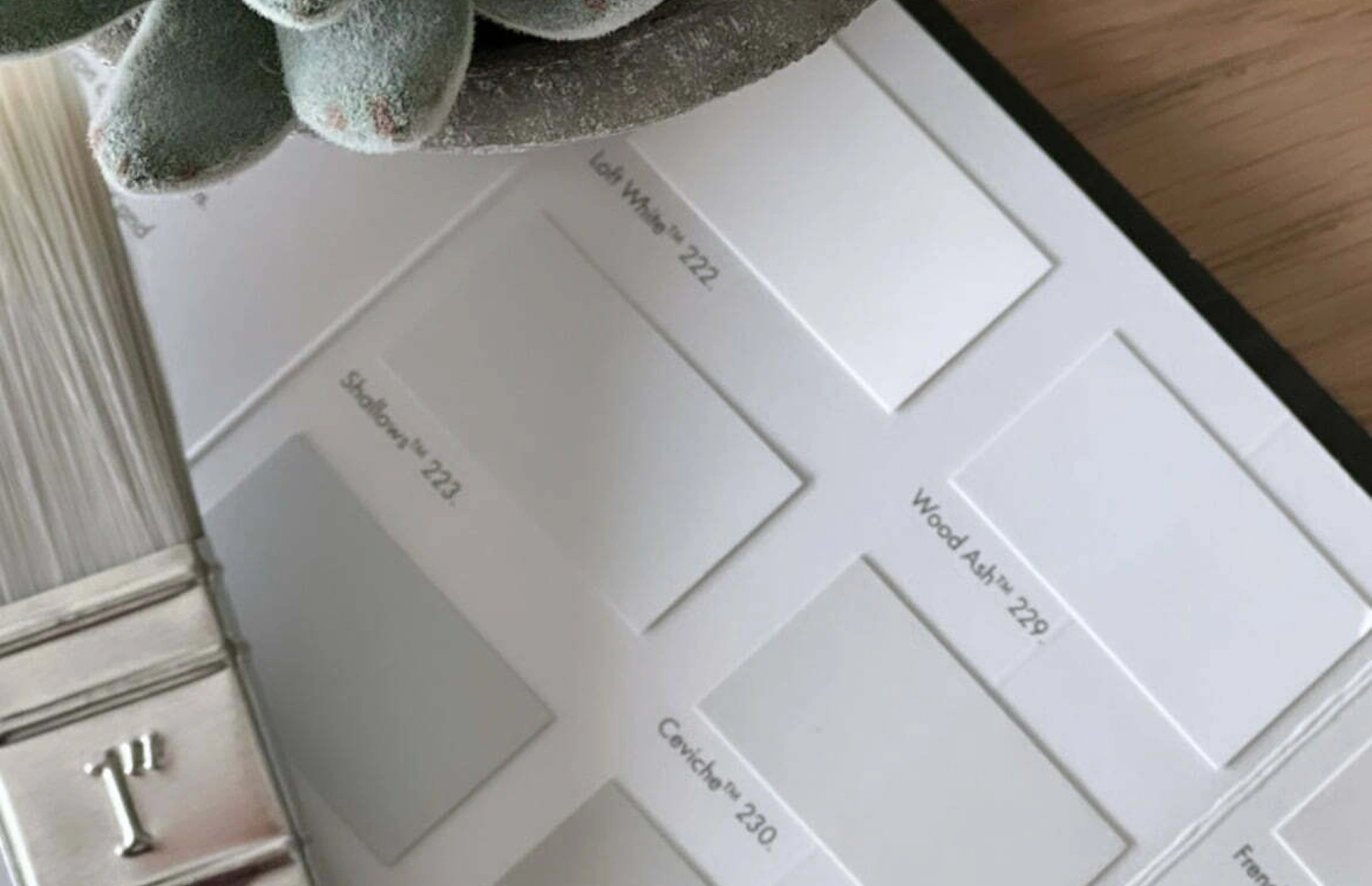 Paint swatch book samples on a table